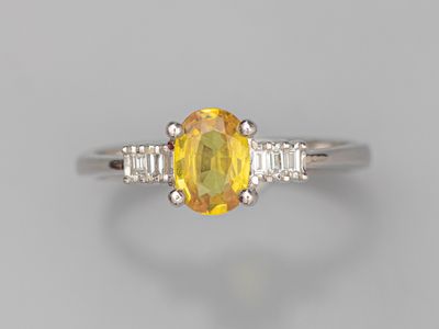 a yellow sapphire and diamond ring