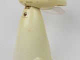 an image of a yellow dog shaped lamp with a cord attached to it ' s head