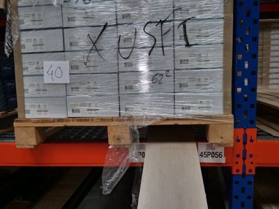 a pallet that has some boxes on it in a warehouse