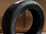 tires are stacked on a cardboard box in front of a cardboard box
