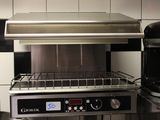 a toaster oven sitting on a counter in a kitchen