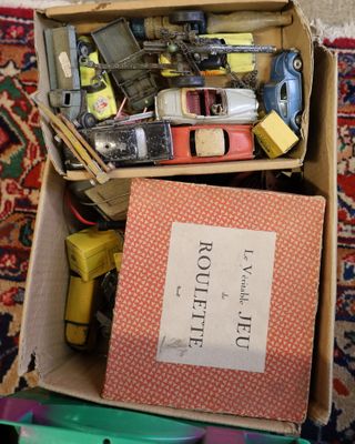 a box full of assorted items sitting on a carpet