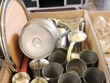 a box full of pots and pans sitting on a table