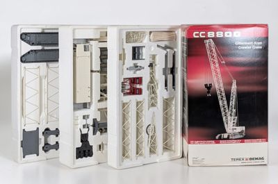 a boxed picture of a model of a crane in a box