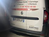 a van that is parked in a garage with its door open