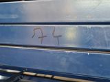 a close up of a blue bench with writing on it