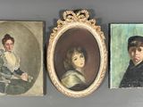 three framed portraits of a woman and a boy are on a wall