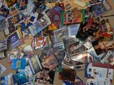 a large pile of dvds and cds on the floor