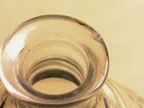 a clear glass vase with a small flower inside of it
