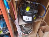 a man that is standing next to a water heater