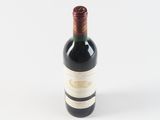 a bottle of wine that is sitting on a table