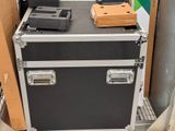 a black and silver case sitting on top of a table
