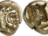 a gold coin with a head of a lion and a head of a lion