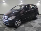 a picture of a black mercedes b - class parked in a garage