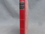 a red book that is sitting on a table