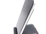 a cell phone that is sitting on top of a stand