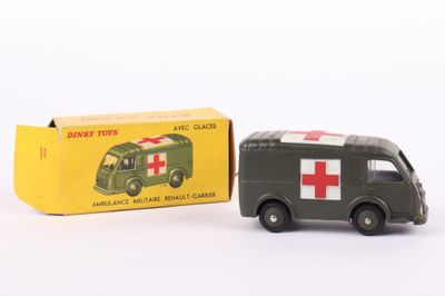 a small toy truck with a red cross on it