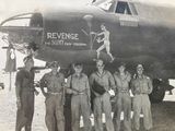 a group of people standing in front of a plane