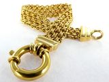 an image of a close up of a gold chain with a ring on it