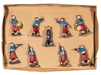 many figurines of people in different outfits in a cardboard box