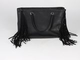a black leather bag with fringes on the handle
