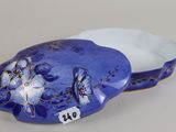 a blue and white box with a flower design on it