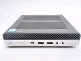 the back of a laptop computer sitting on top of a white surface