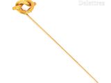 a close up of a gold stick with a knot on it