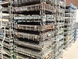a large pile of lobster cages stacked on top of each other