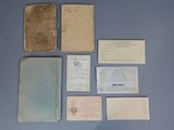 an image of a collection of old books and papers on a table