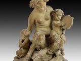 an image of a statue of a man and two children