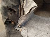 a piece of fabric that has been torn off of a couch