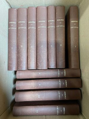 les livres sont empilés dans une boîte en carton