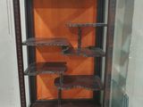 an antique display case with shelves and shelves inside of it
