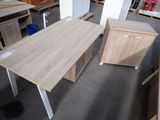 two desks and a cabinet in a room