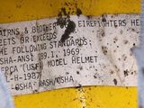 a sign on the side of a yellow truck