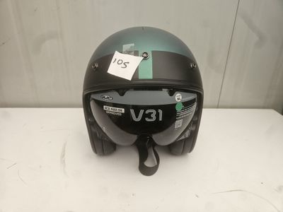 a helmet on a table with a tag attached to it