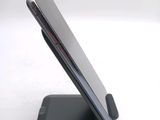 a close up of a cell phone on a stand