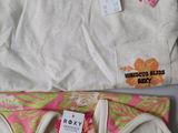 two pairs of women ' s underwear are on display on a table