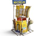 a stand with a bunch of books and a sign on it