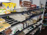 a man standing in front of a shelf of food in a store