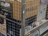 a large metal cart with many boxes on top of it