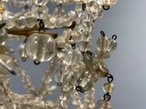 a chandelier made of glass beads hanging from the ceiling