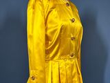 an image of a yellow jacket on a mannequin mannequin