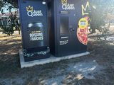 two vending machines that are on the side of the road