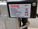 a label on the back of a toaster that says tefal