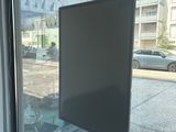 a picture of a window that has a sign on it