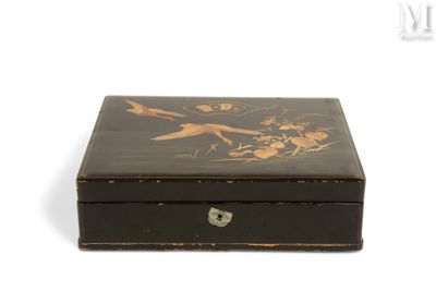 a small black box with flowers and birds on it