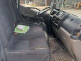 an image of the inside of a van with the driver ' s seat down