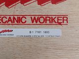 a sticker on a piece of wood that says mechanic worker